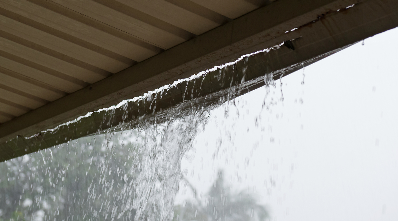 gutter that needs to be repaired leaking rain water